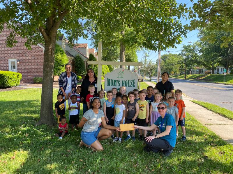 With funds raised from their vegetable sale, students and staff from the Bayhealth childcare center delivered a donation to Mom's House in Dover. SUBMITTED PHOTO